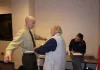 Taking measurements for body armor.