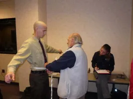 Taking measurements for body armor.