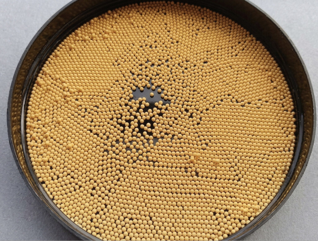 Ceria-modified zirconia beads. The golden coloration is entirely from ceria, which is yellow in pure form